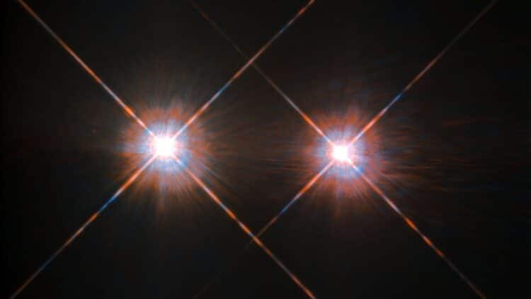Closest solar twin spotted host a cold giant
