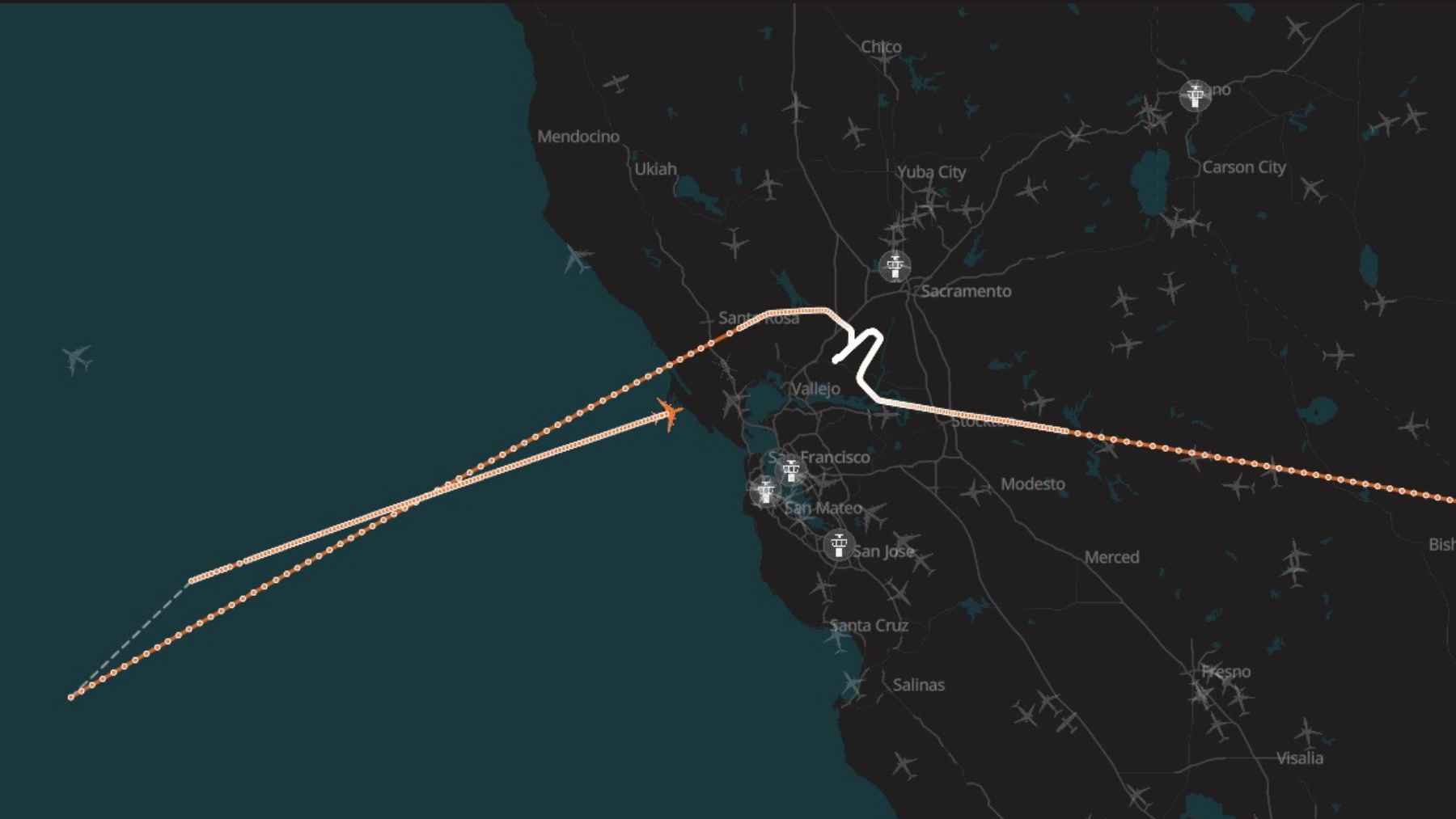 Flight-tracking map shows a U.S. Air Force aircraft route over Northern California and the Pacific, looping back toward Travis Air Force Base.