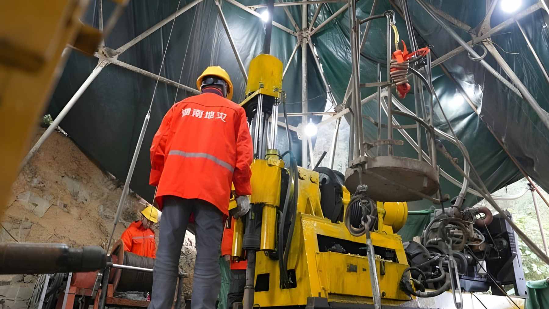 Geologists examine drilling equipment at the Wangu gold field in Hunan after locating a massive deep underground gold deposit.