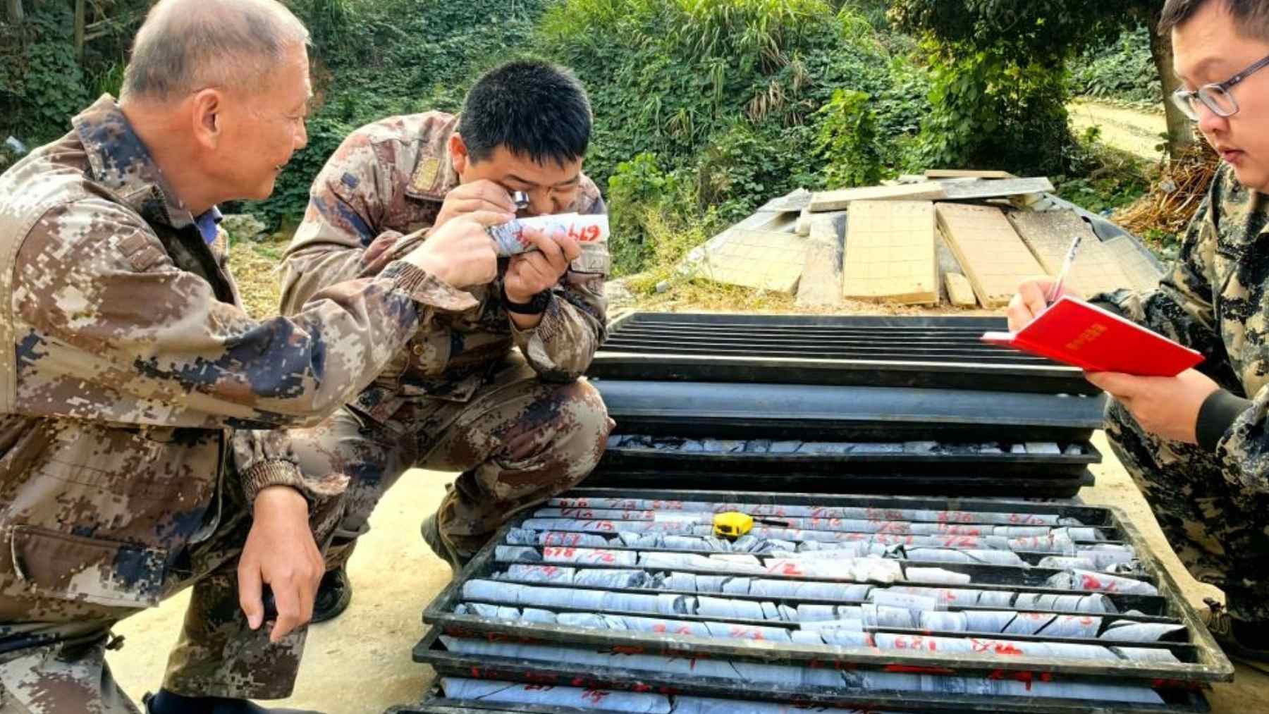 Geologists examine drill core samples from the Wangu gold field in Hunan, China