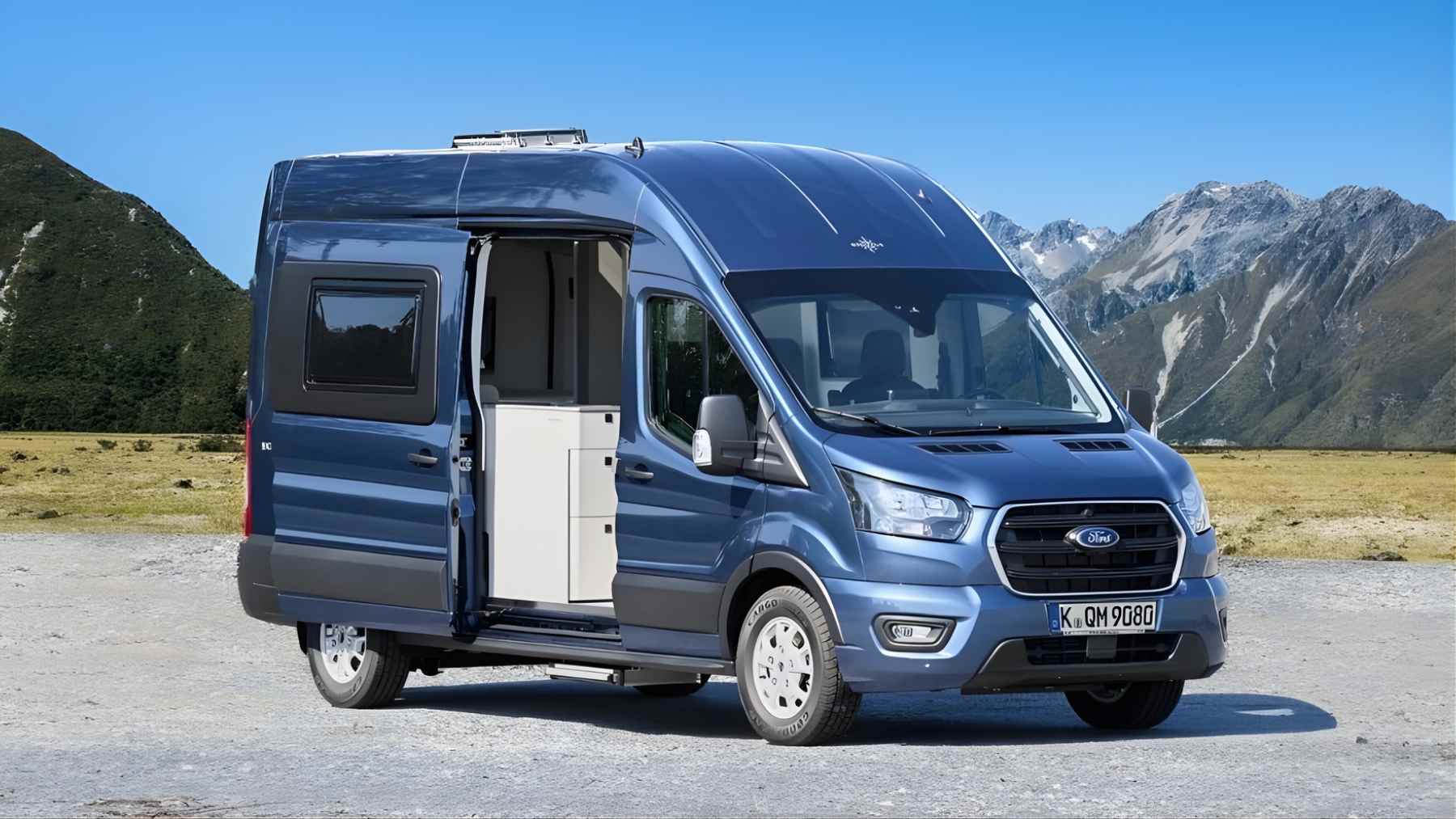 Ford Nugget 40th Anniversary camper van parked outdoors with the side door open, showing the compact interior module.