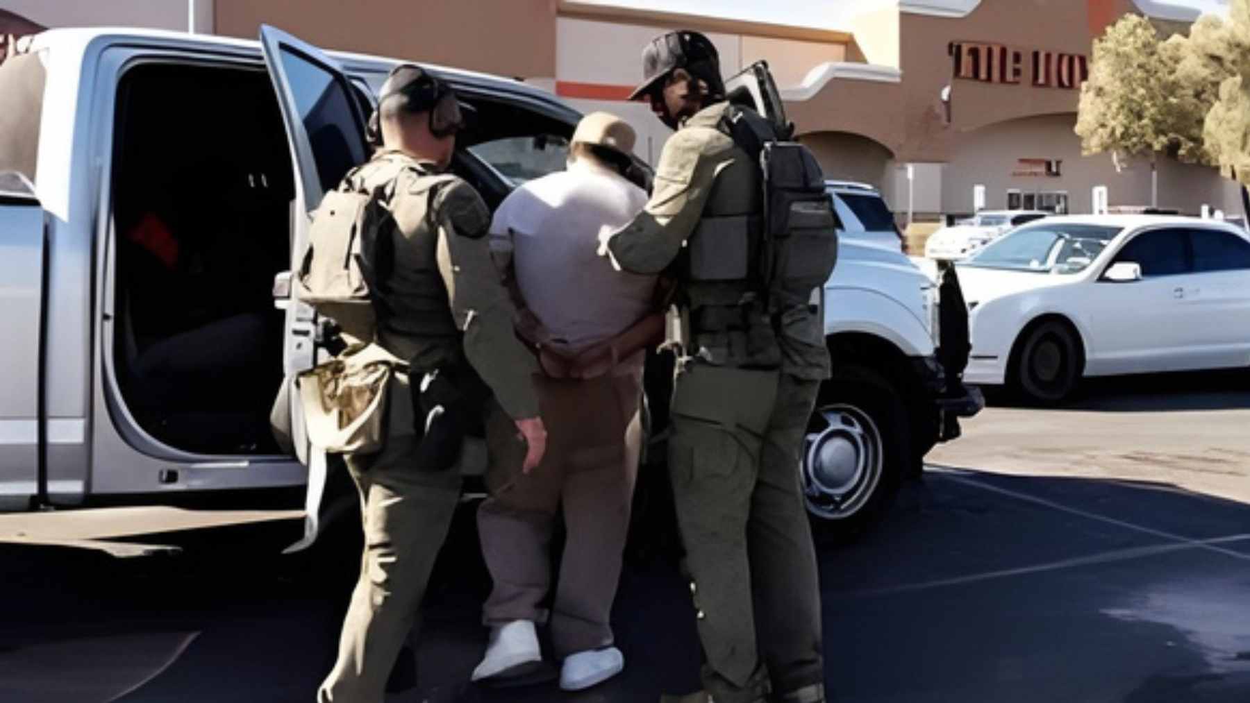 Immigration agents move through a Home Depot parking lot in Downey as workers and shoppers react to a sudden enforcement operation.