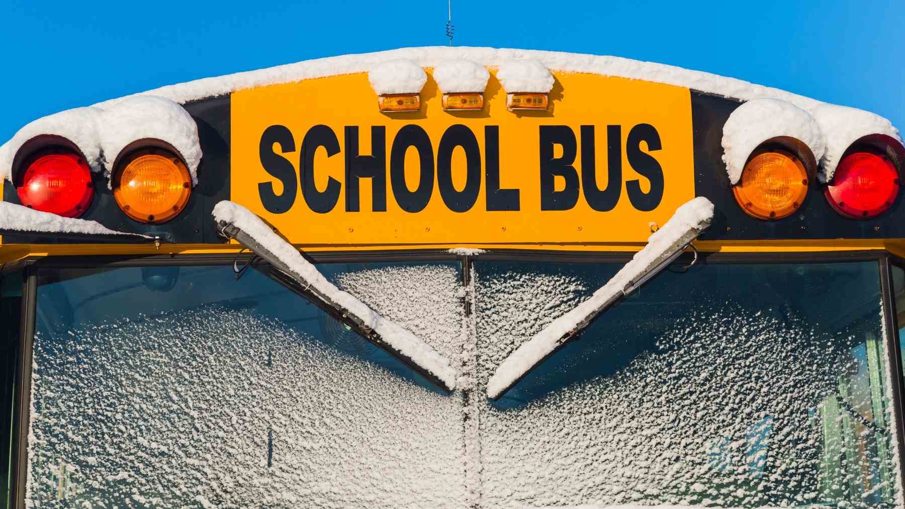 Iced-over school bus windshield as Texas ice forces Ingram ISD cancellations and delays across the San Antonio area