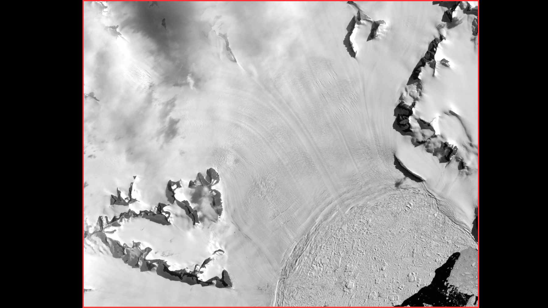 Black-and-white satellite image of Hektoria Glacier on the Antarctic Peninsula, showing ice flow lines and crevassed terrain.