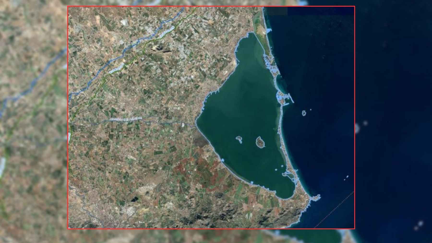 Satellite image of Mar Menor lagoon in southeastern Spain, bordered by the La Manga sandbar and the Mediterranean Sea.