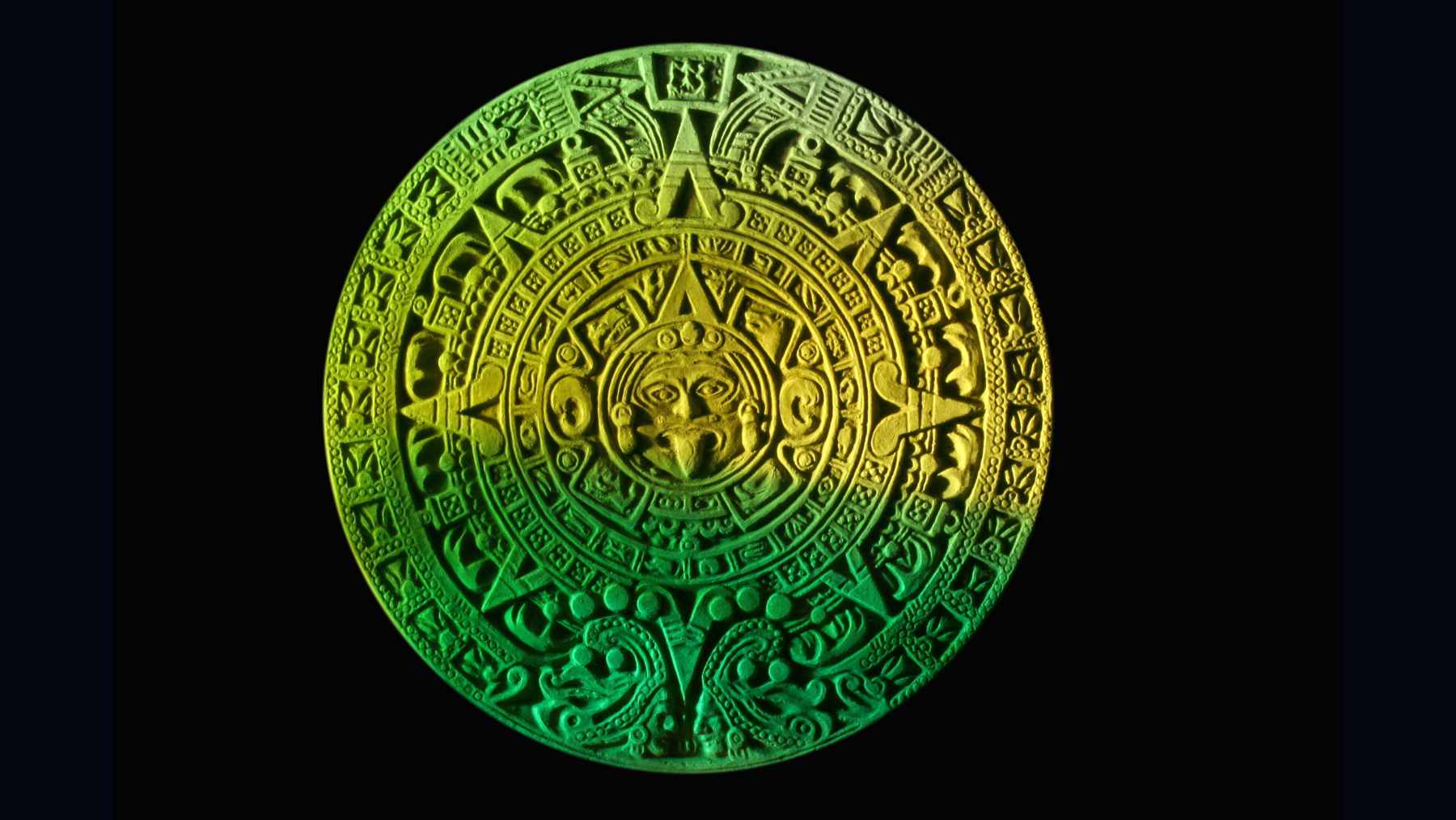 Green-lit Maya calendar stone wheel, used as a visual reference for a new explanation of the 819-day cycle and long-term sky timing.