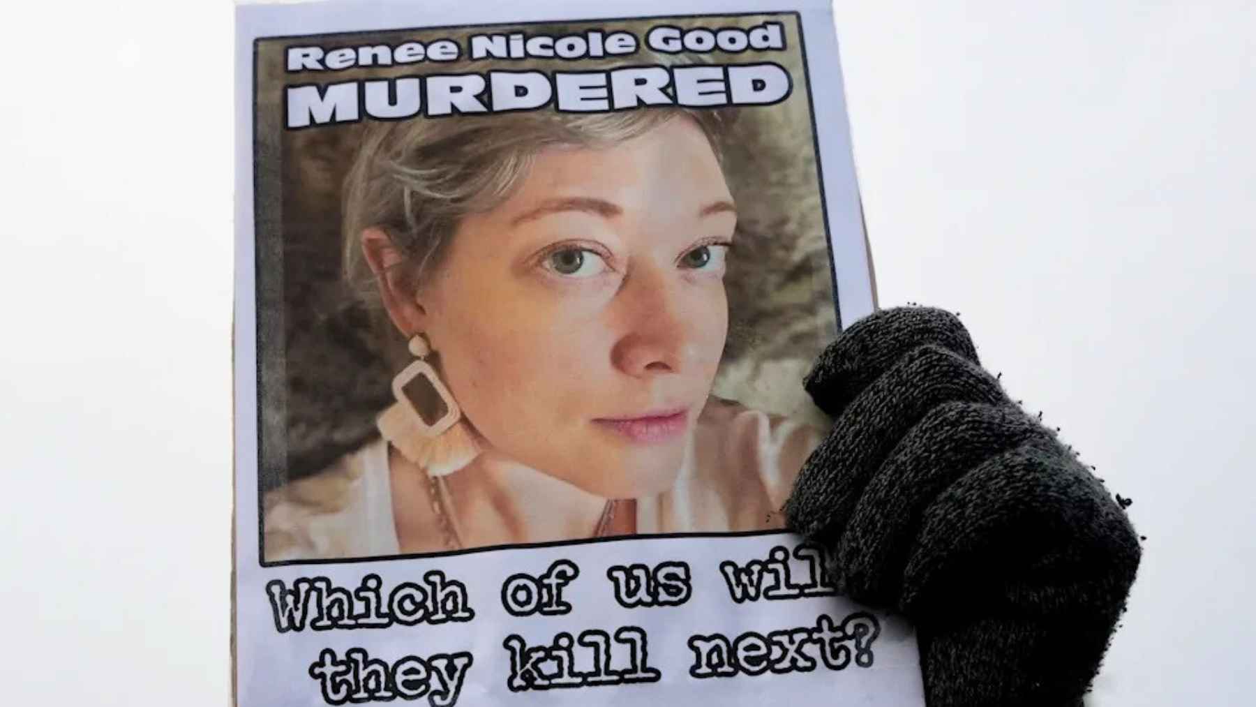 A protest sign shows Renee Nicole Good’s photo and the word “Murdered” after her death during a federal immigration operation in Minneapolis.