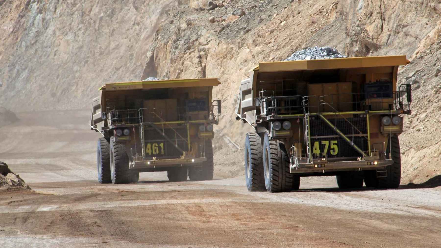 Autonomous mining trucks hauling coal at a large open pit mine in Xinjiang, China