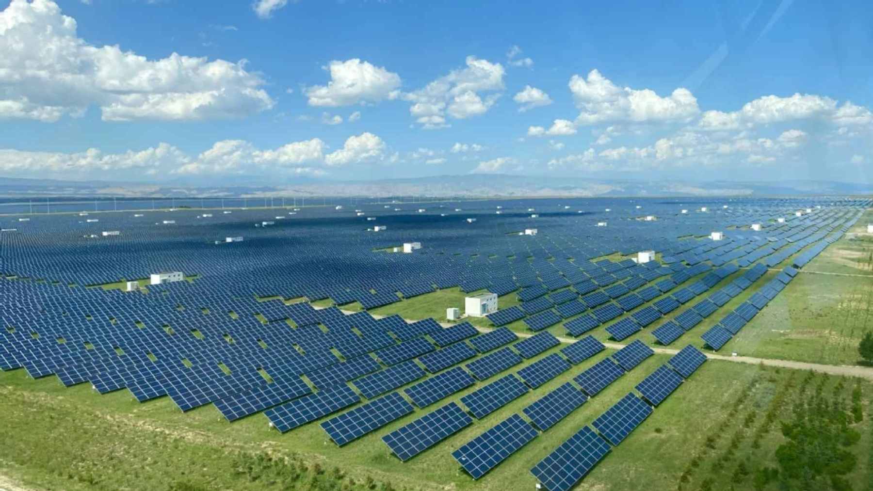Solar panels covering an alpine desert on the Tibetan Plateau where vegetation and soil moisture are increasing beneath the array.