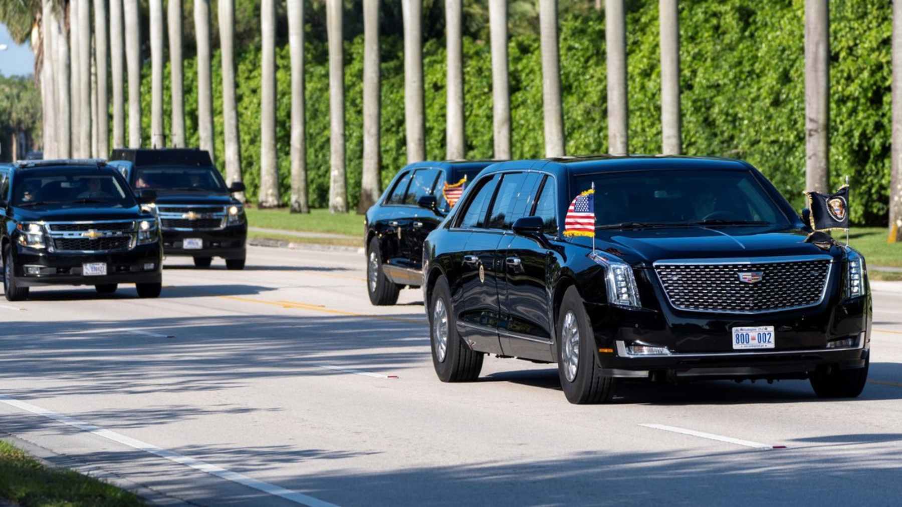 Presidential motorcade vehicles travel near Palm Beach International Airport after a suspicious object prompts a route adjustment.