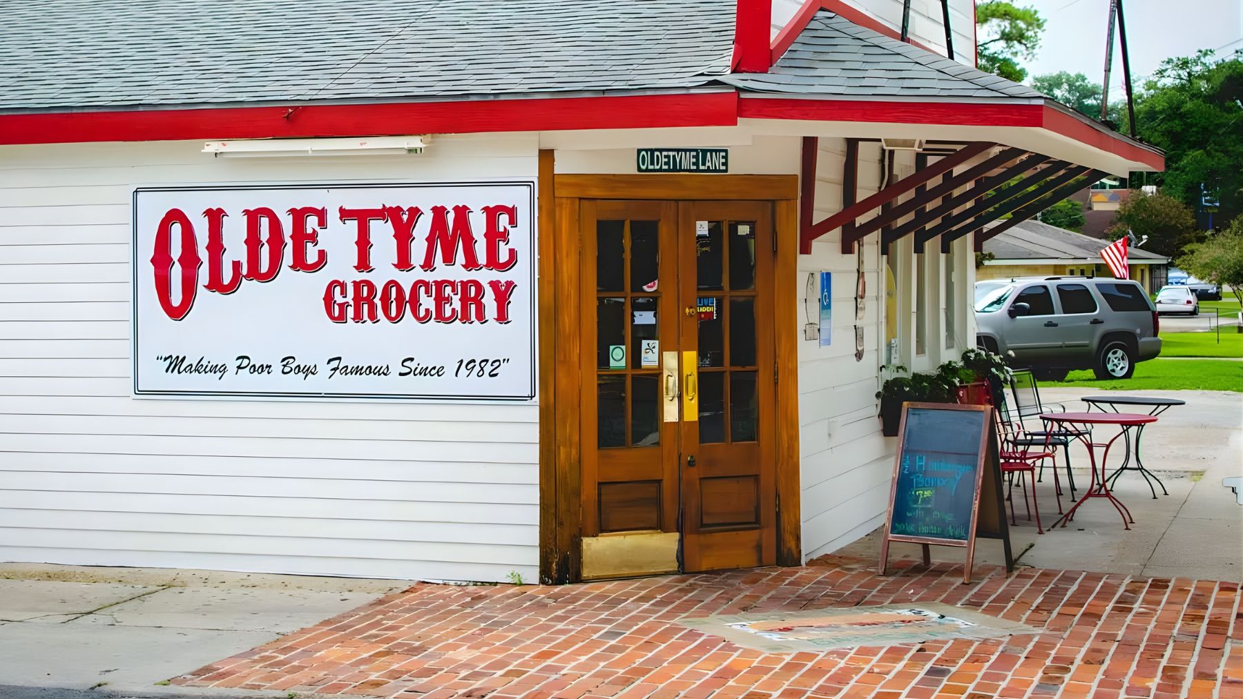 Exterior of Olde Tyme Grocery near the University of Louisiana at Lafayette, where a parking lot swap is tied to corridor redevelopment plans.