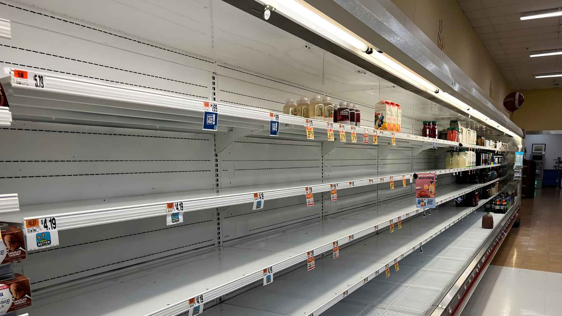Empty grocery store shelves and a quiet aisle, as Avondale’s only full-service market struggles to keep fresh food in stock.