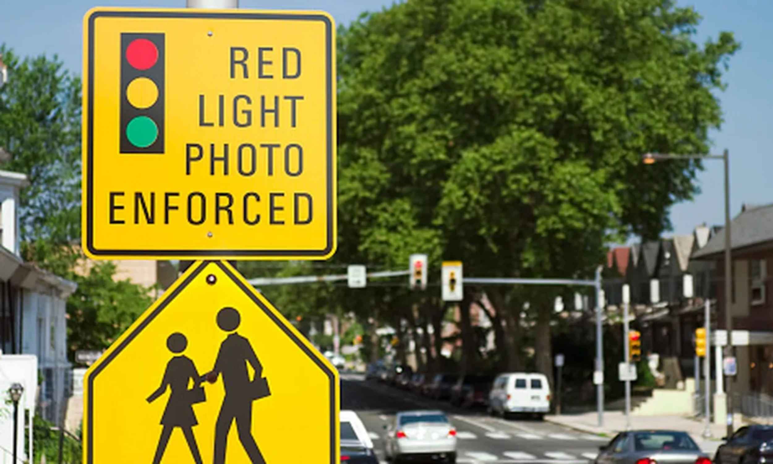 Red light traffic camera mounted at a California intersection under automated enforcement