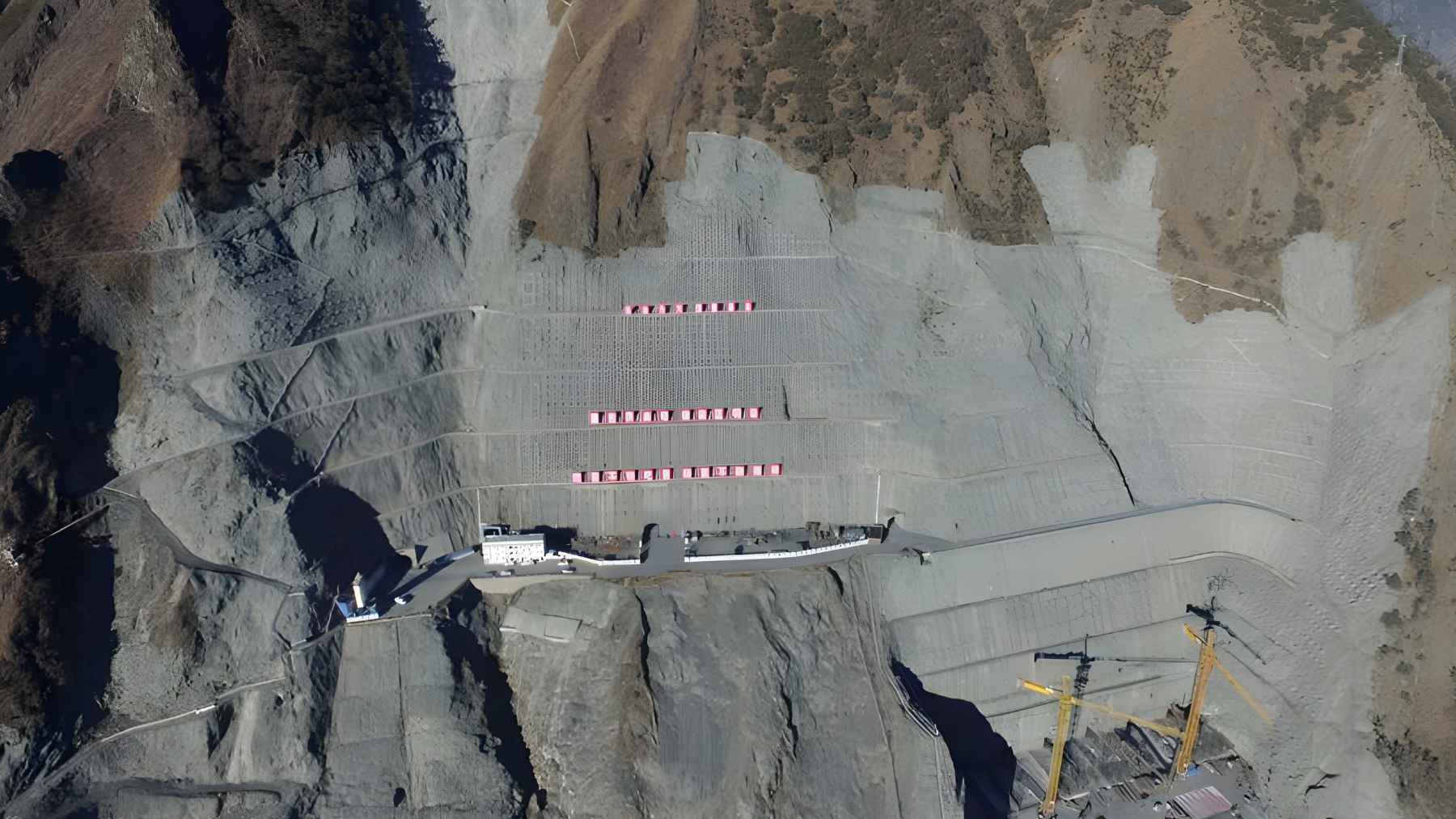 Aerial view of the Lianghekou hydropower dam on the Yalong River in Tibet, rising 295 meters above the valley.