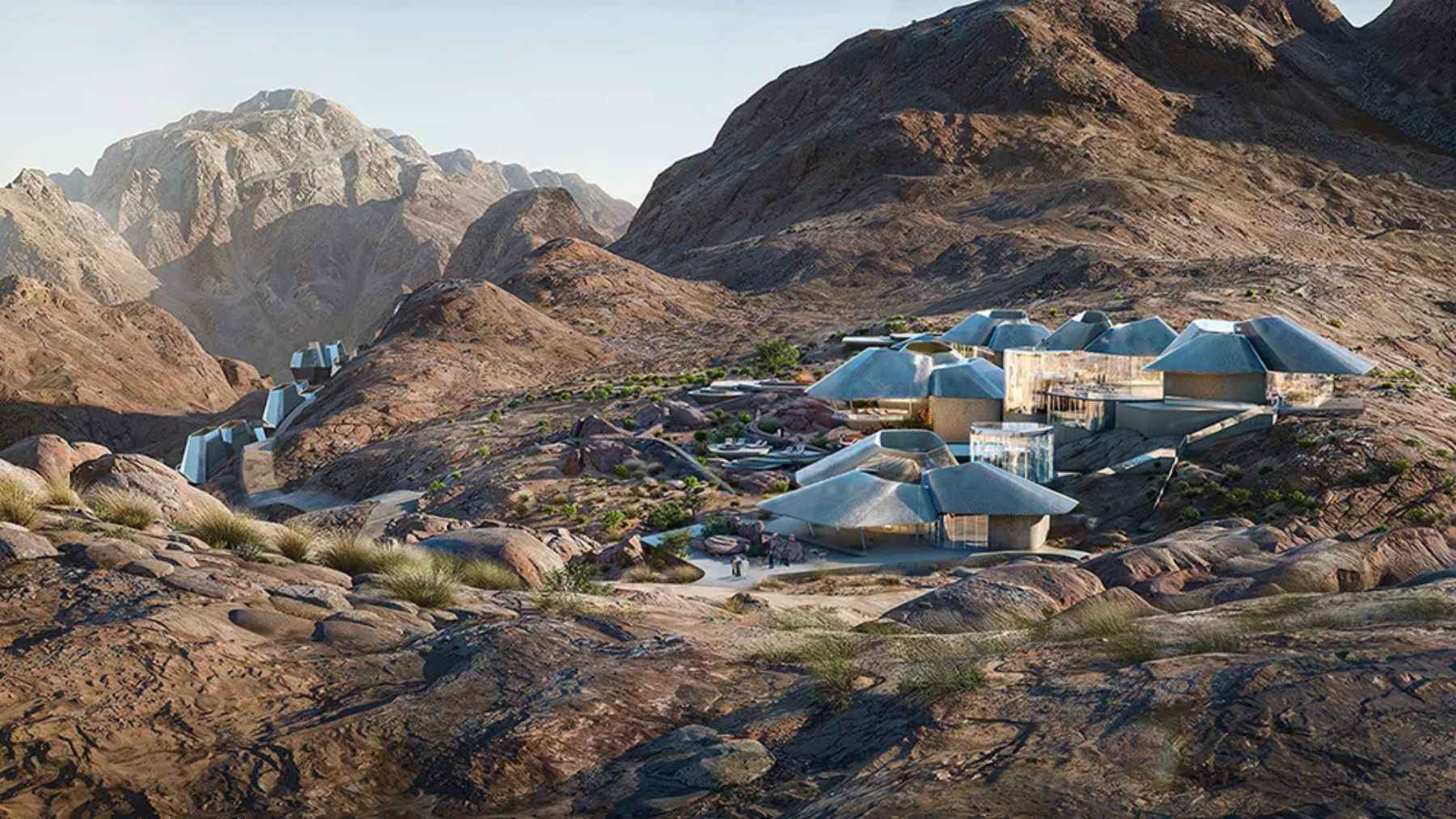 Concept rendering of Neom buildings set into a rocky desert mountain landscape in Saudi Arabia, reflecting the project’s redesigned plans.