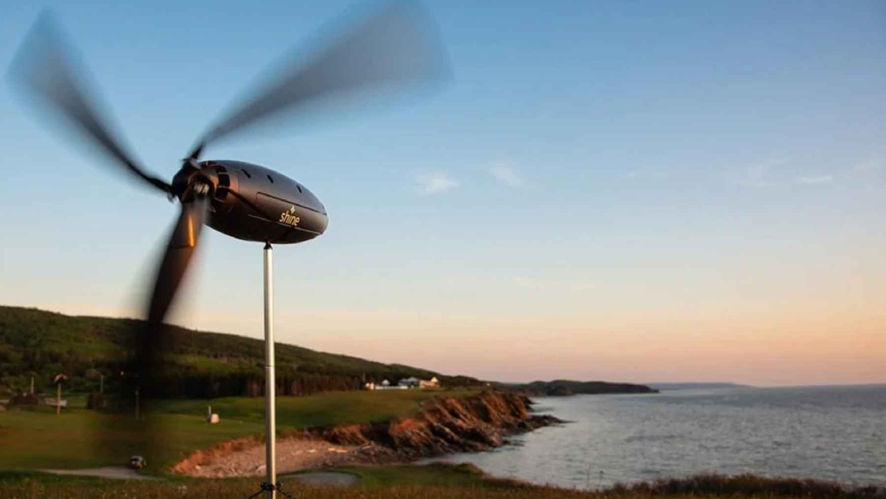 Shine 2.0 portable wind turbine charging devices in light wind outdoors