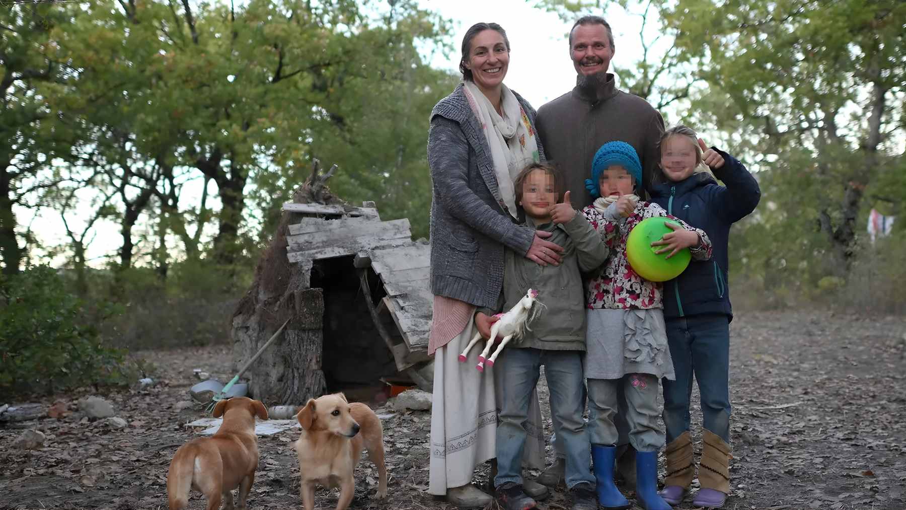 Nathan Trevallion and Catherine Birmingham with their three children outside their off-grid forest home near Palmoli, Abruzzo.