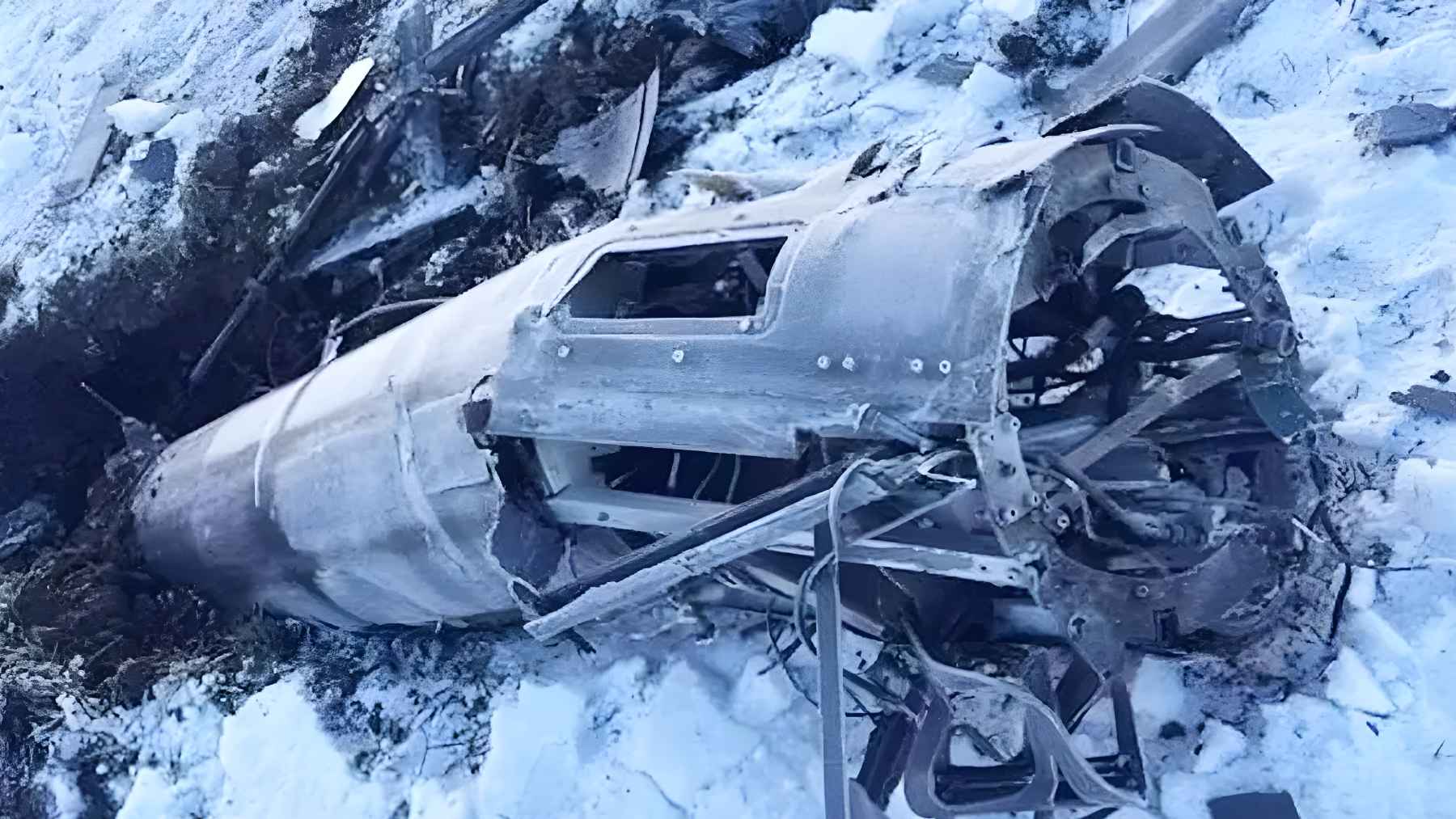 Ukrainian technicians inspect the wreckage of a Geran-5 drone, revealing foreign electronic components inside