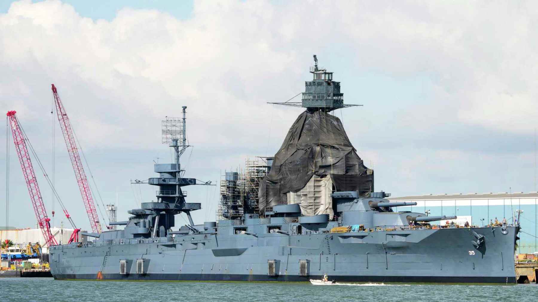 The USS Texas sits afloat near Galveston as restoration work continues on the historic battleship’s superstructure.
