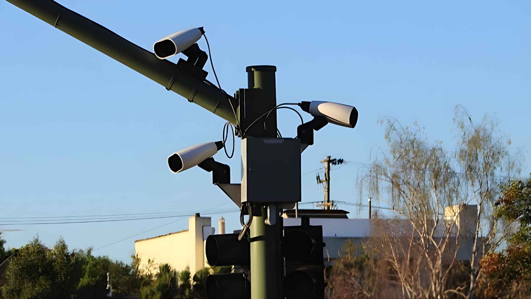 Traffic cameras mounted over a Washington roadway as the state moves to limit license plate data collection