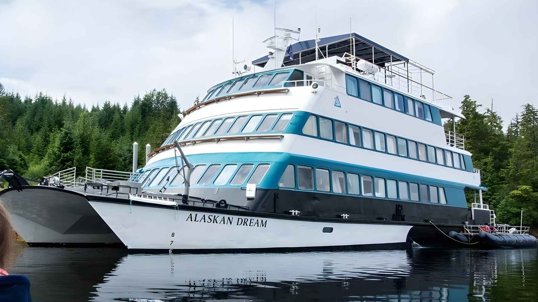 Alaskan Dream cruise ship moored in Alaska waters, representing the small-ship line that suddenly ceased operations before the 2026 season.