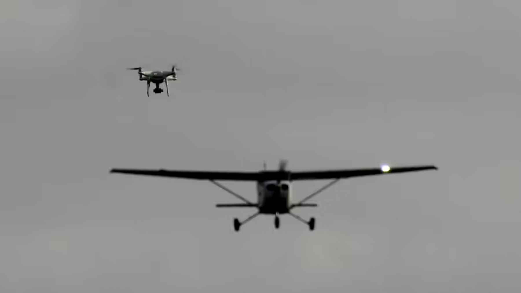 Drone flying near a small aircraft, illustrating the growing risks and limits of anti-drone defense systems in shared airspace.