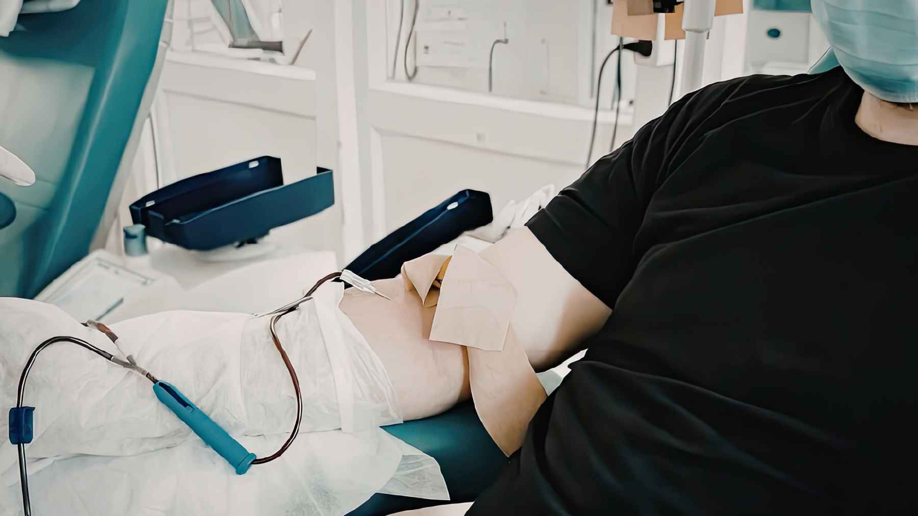 Patient undergoing dialysis in a medical clinic as scientists advance artificial kidney research using human stem cells