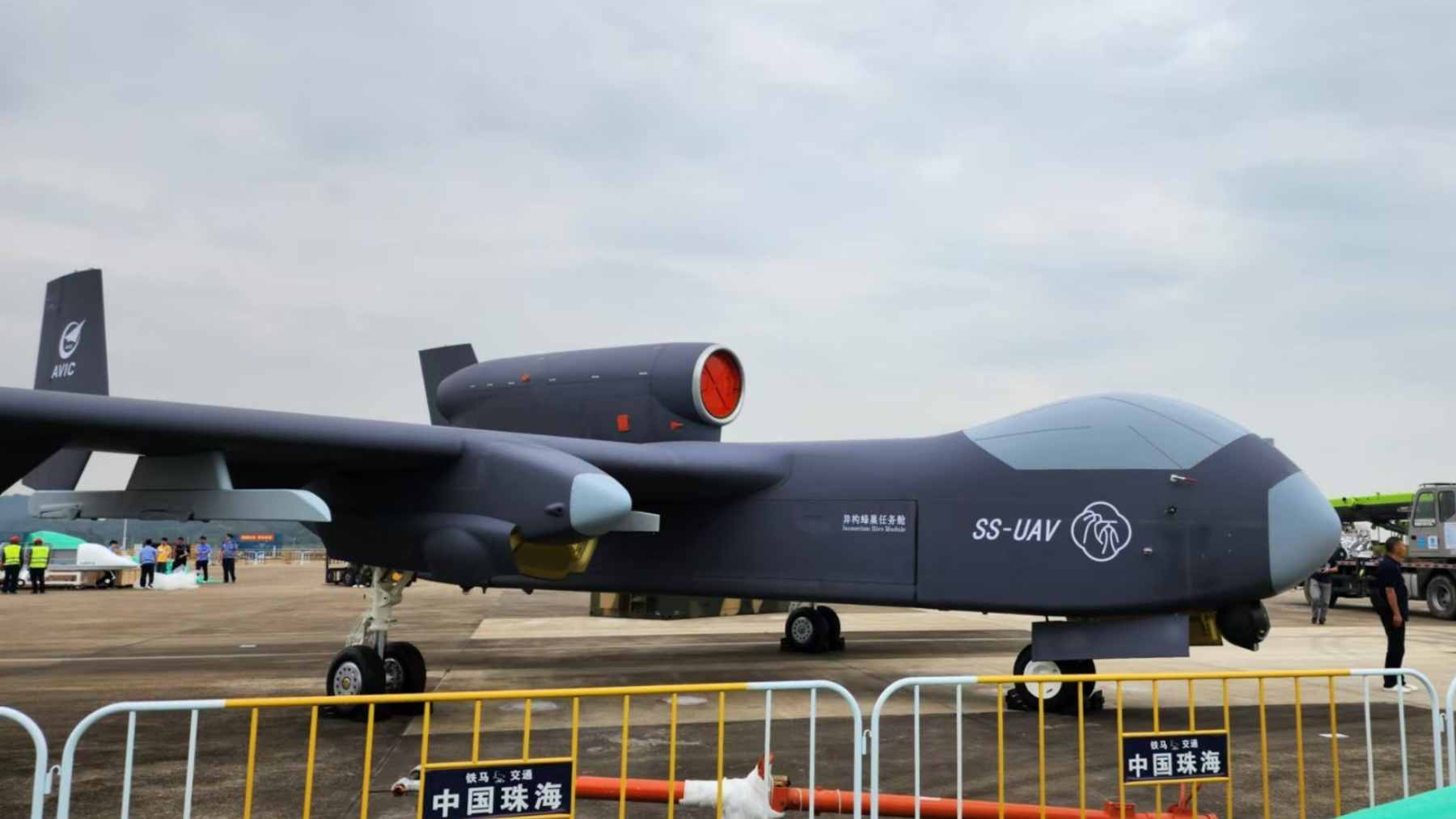 The Chinese "Jetank" (Jiutian) heavy-lift drone on a runway, featuring a 25-meter wingspan and 12-hour endurance.