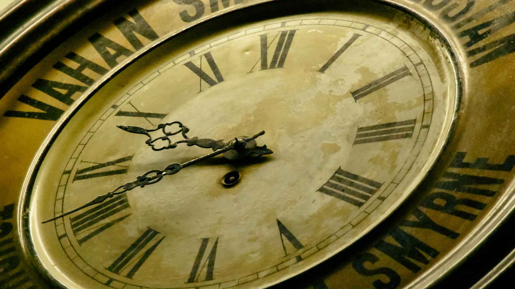 Vintage clock face illustrating a study on quantum time, electron transitions, and attosecond delays in different materials