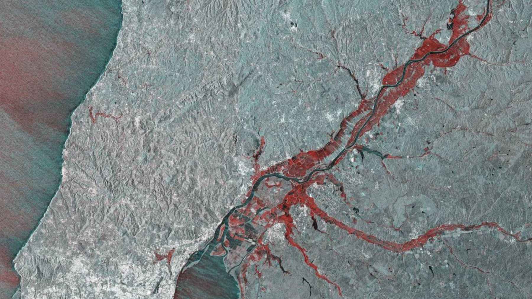 Satellite view of storm system over Spain showing heavy rainfall and flooding across the Iberian Peninsula