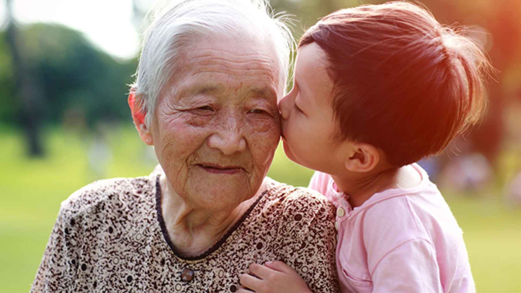 Grandparents spending time caring for their grandchildren, an activity linked to better memory and language skills in older adults.