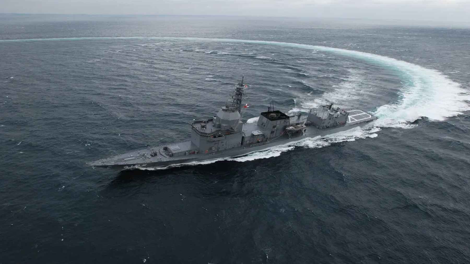 Japanese Maritime Self-Defense Force test ship JS Asuka sailing during sea trials for a high-energy laser weapon system.