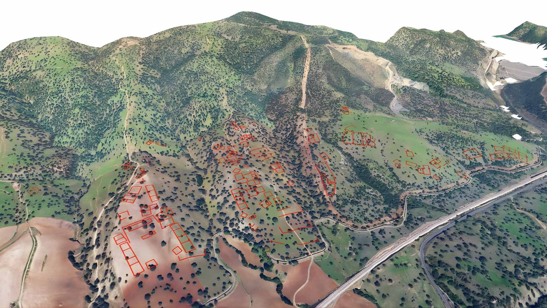 A high-resolution LiDAR digital terrain model of the hills near Córdoba, showing the rectangular outlines of a buried medieval city.