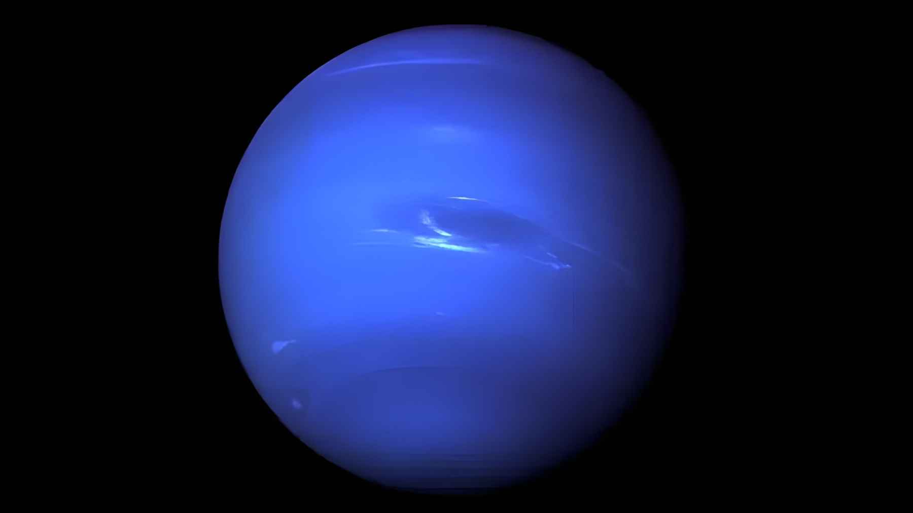 Full-disk image of Neptune in deep blue tones against black space, illustrating research on the planet’s unusual magnetic field.