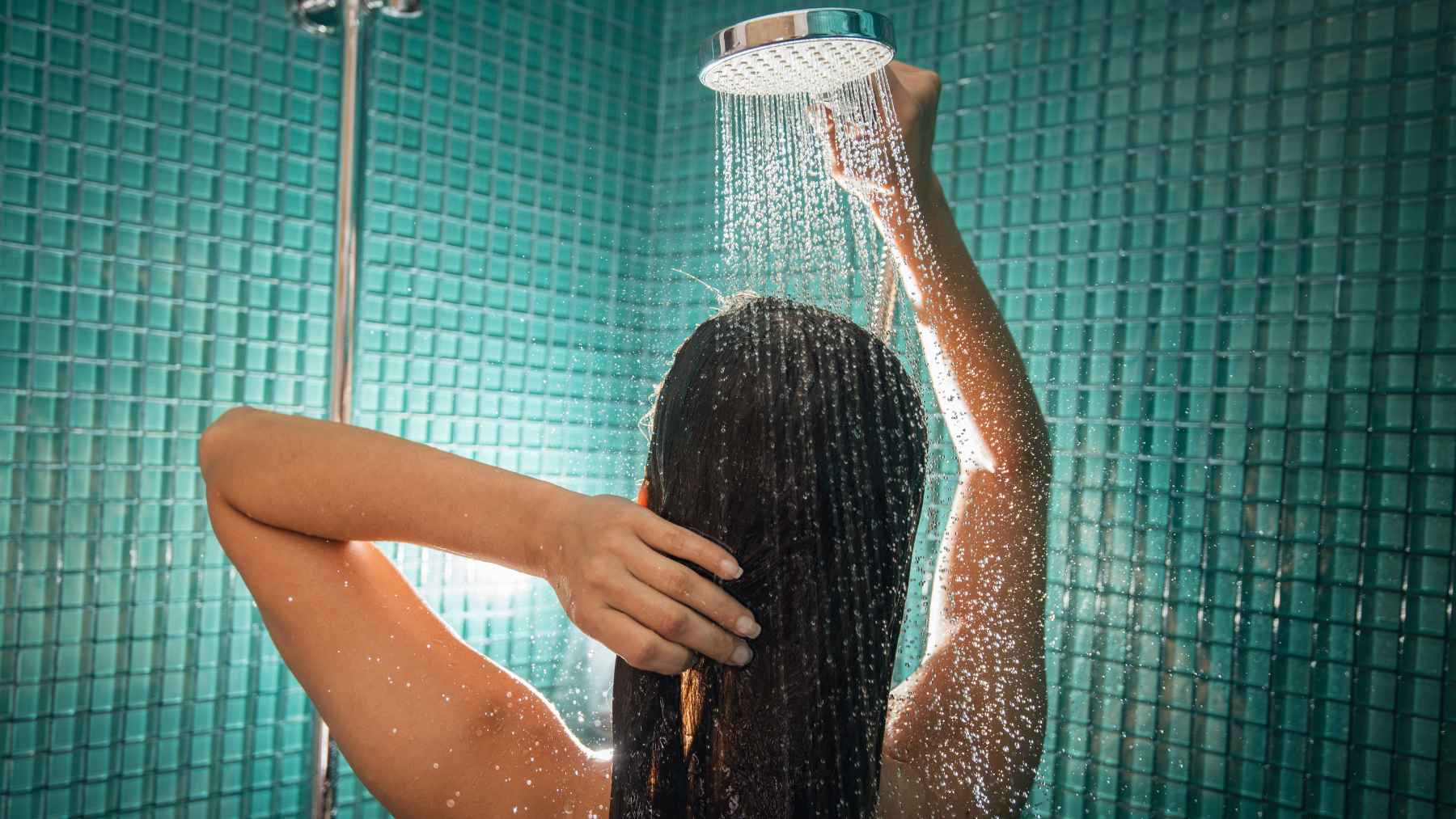 Woman showering at night as part of a calming bedtime routine linked to better sleep quality