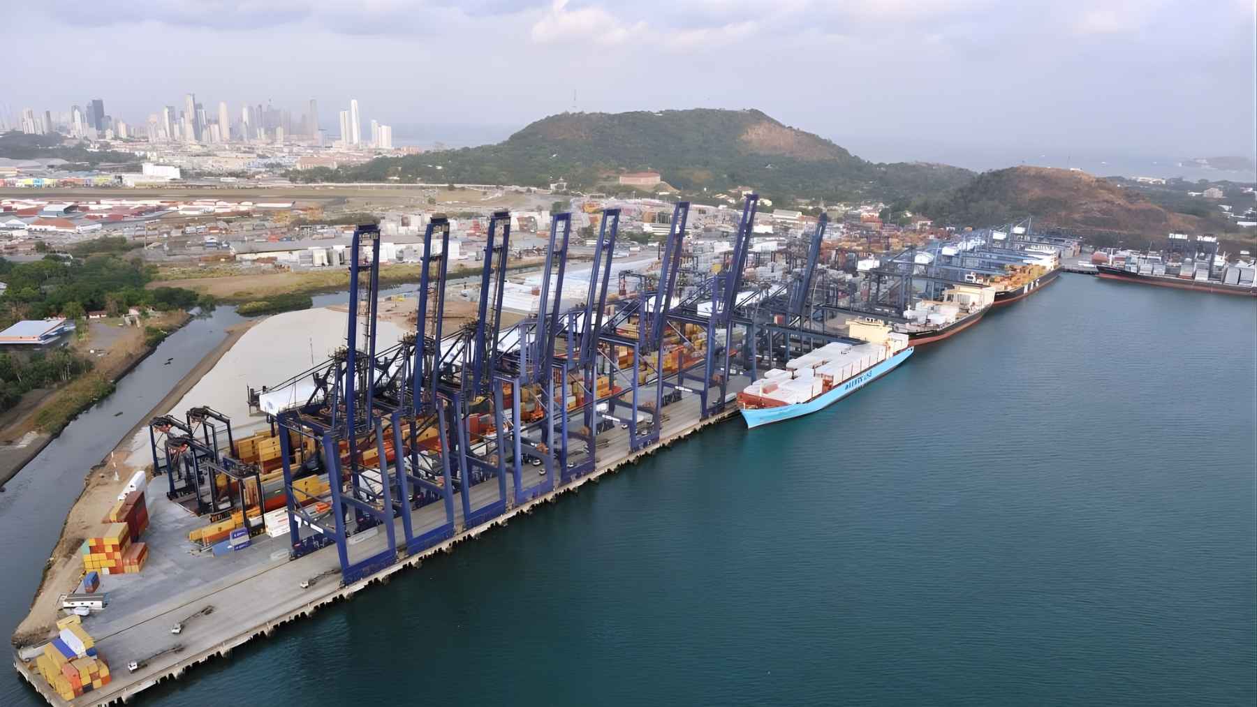 ECOnews 1 Aerial view of a major container port near the Panama Canal, showing cranes, cargo areas, and ships at berth amid the port dispute