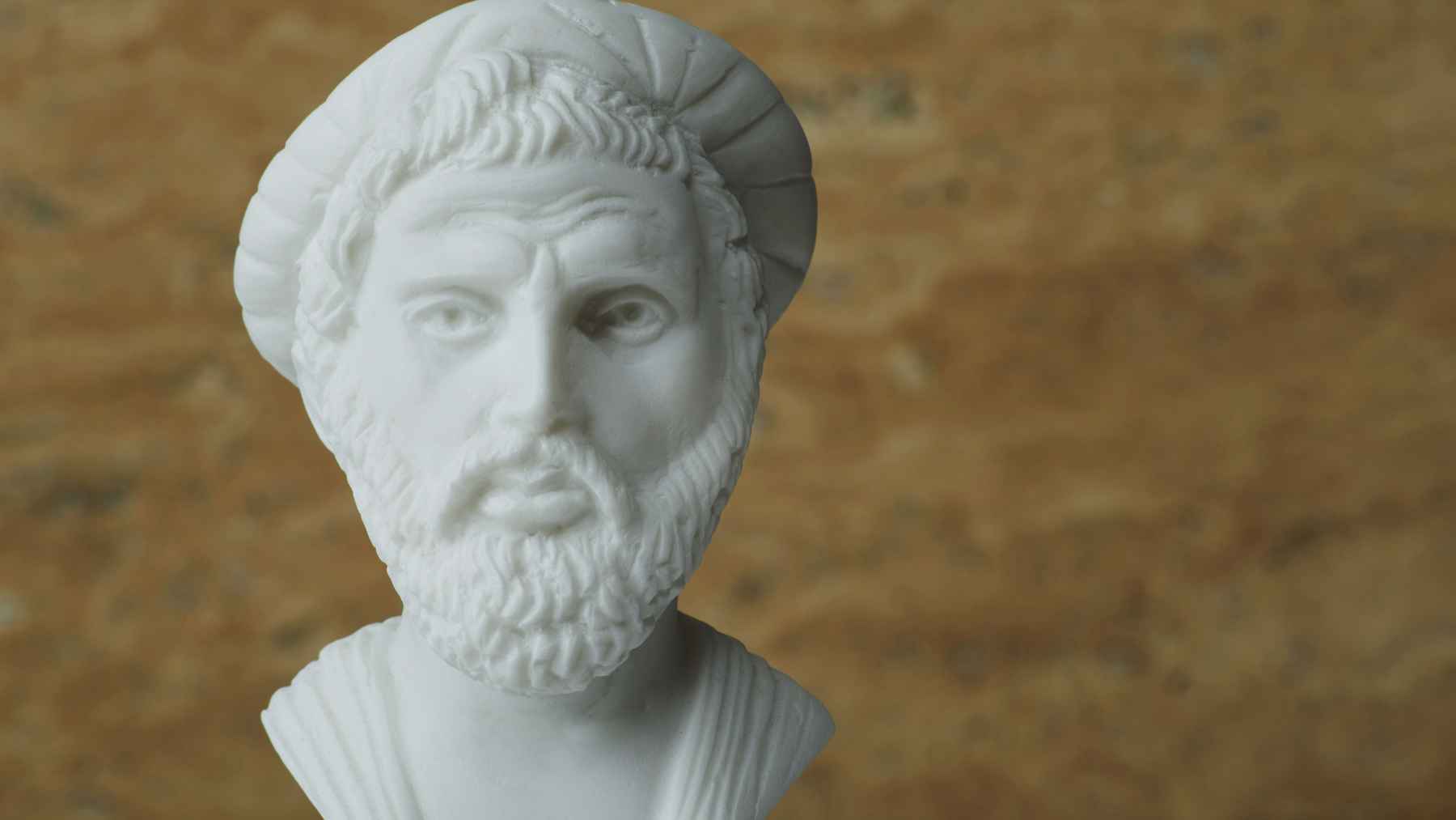 White bust of Pythagoras, the Greek philosopher and mathematician associated with a quote about old wine, friendship, and long life.