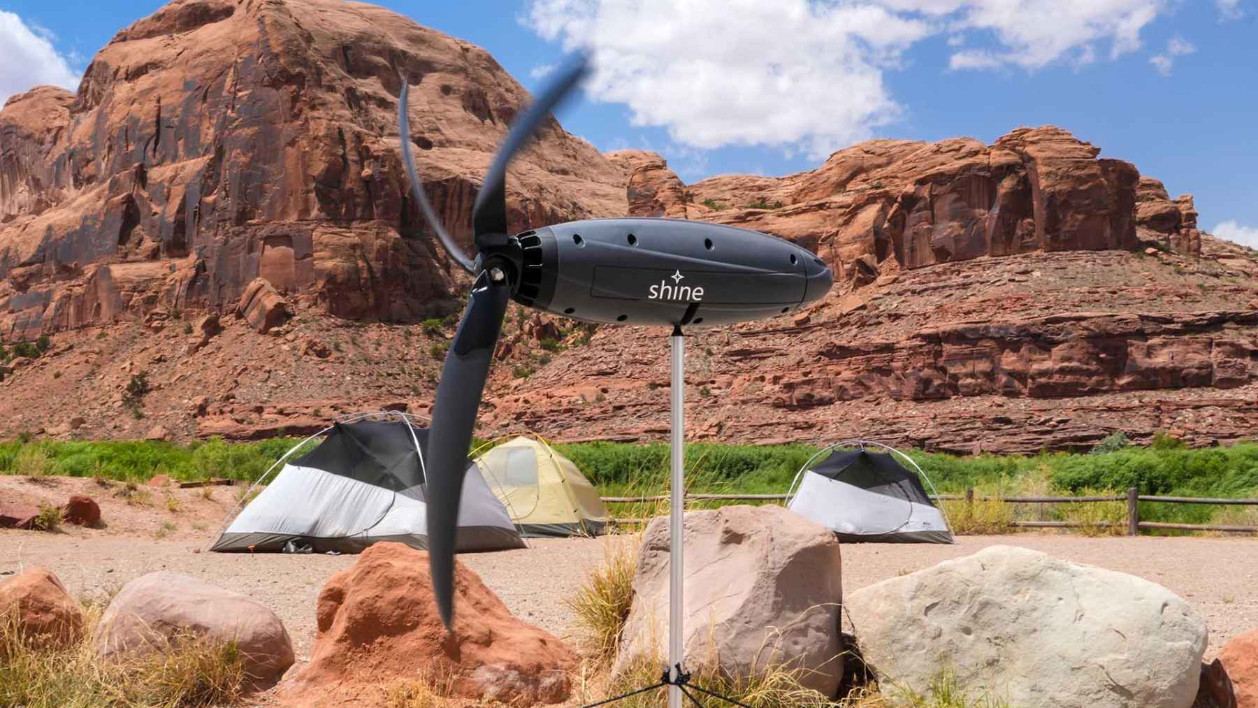Shine 2 portable wind turbine generating electricity outdoors to charge phones and small devices