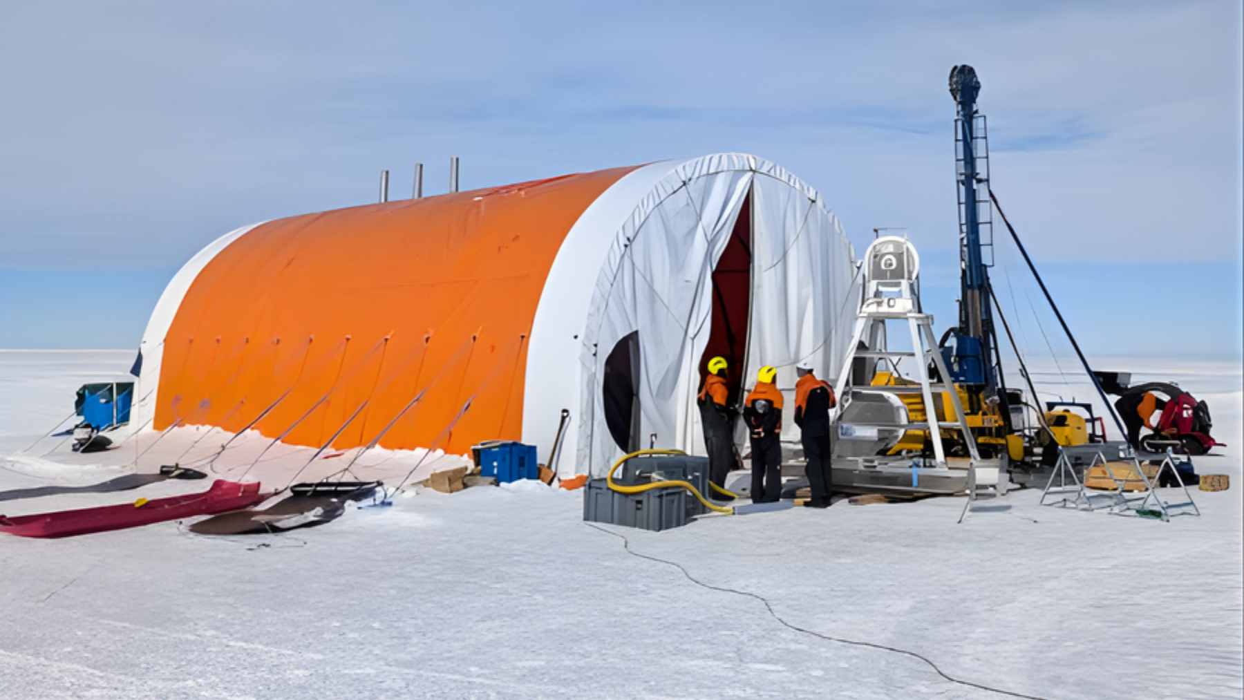 A specialized hot-water drill system and sediment coring rig positioned on the vast, flat expanse of the Crary Ice Rise in West Antarctica.