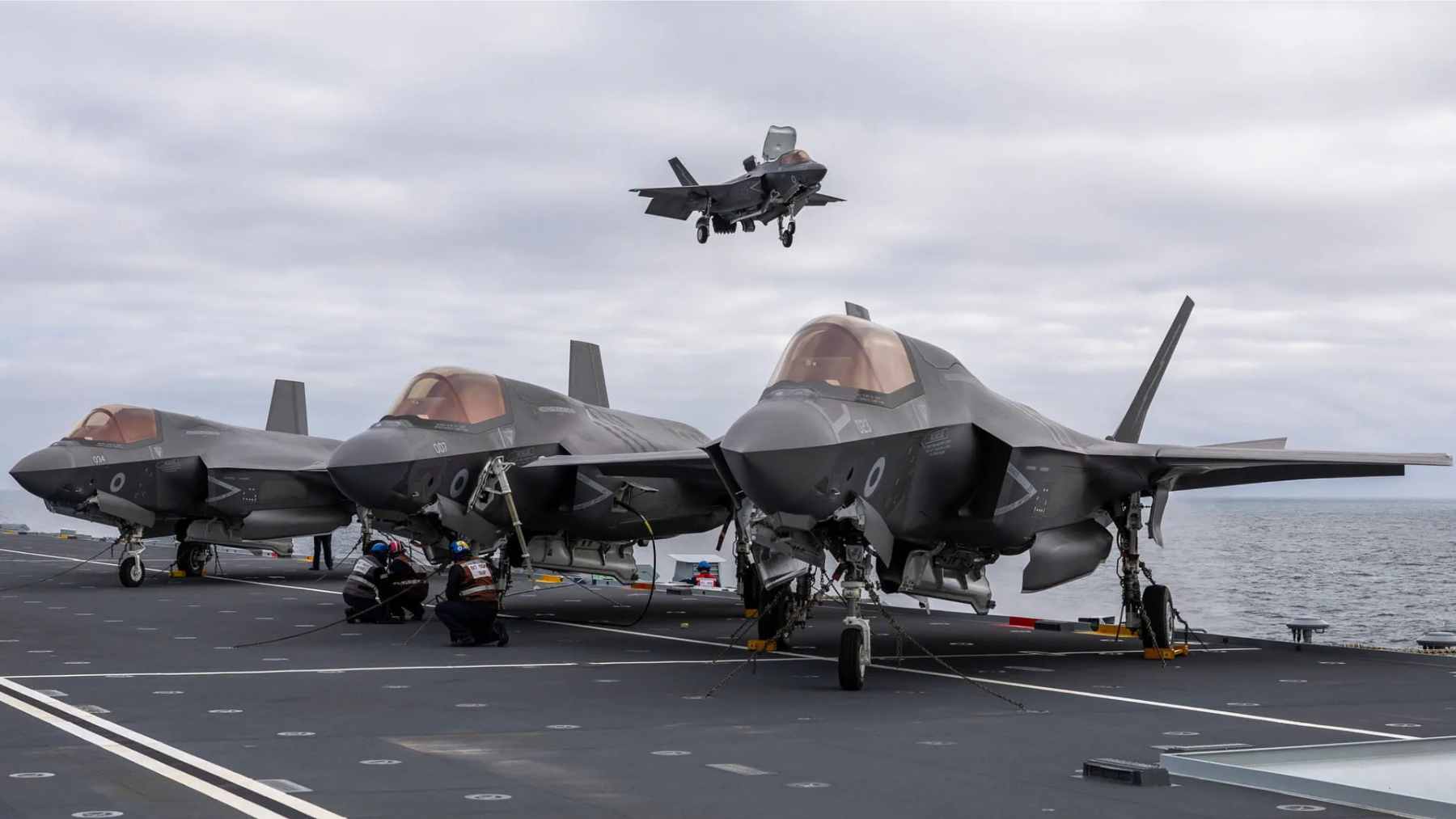 The British aircraft carrier HMS Prince of Wales navigating through icy Arctic waters during a naval deployment.