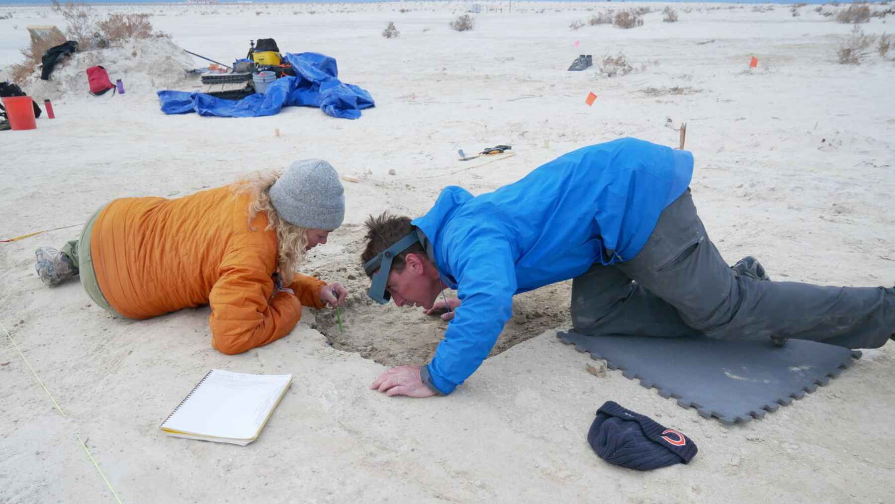 Archaeologists examining ancient human footprints at White Sands National Park in New Mexico, where the tracks have sparked major debate over early human presence