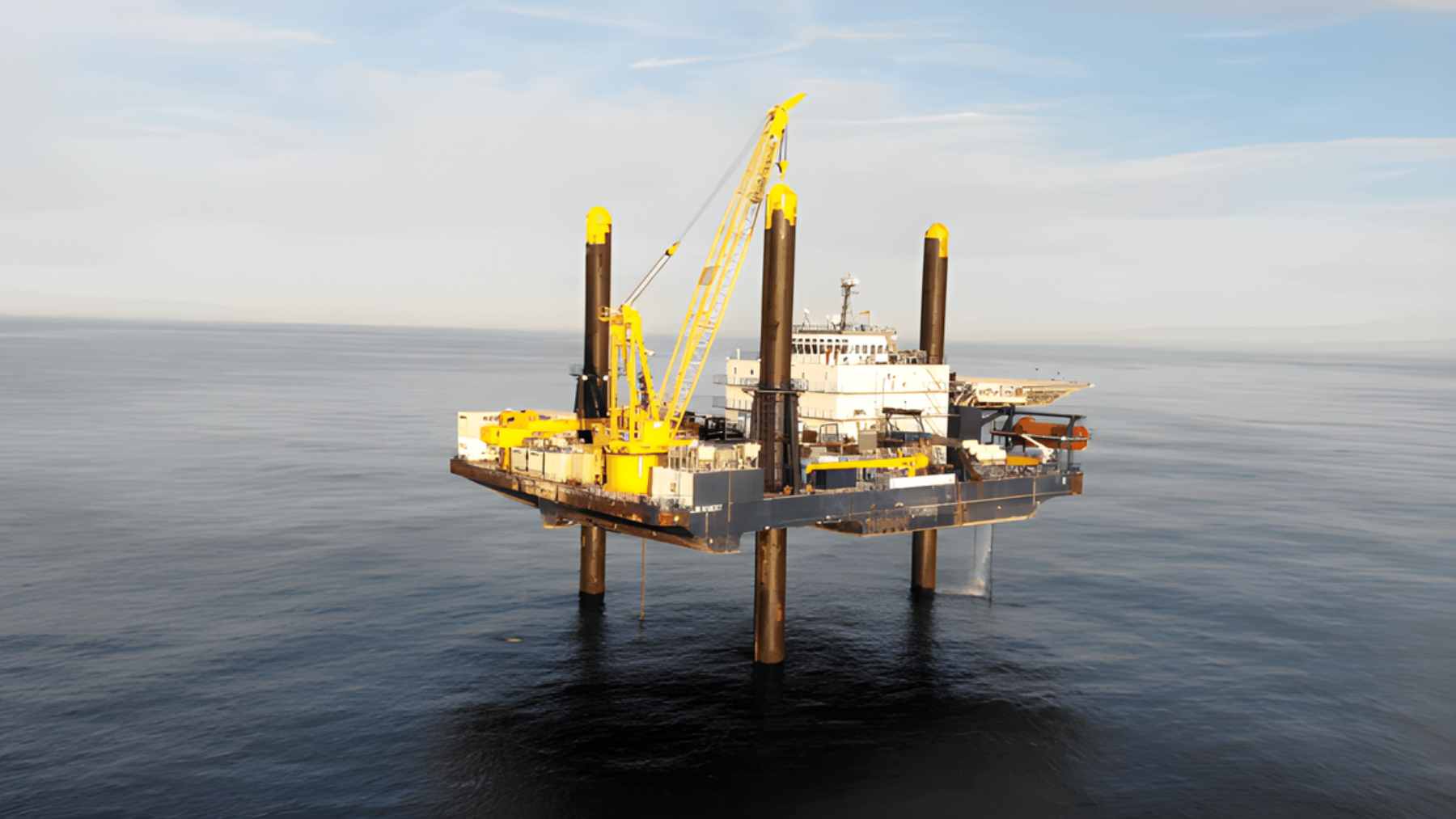 An offshore drilling vessel operating in the Atlantic Ocean to extract core samples from the continental shelf.