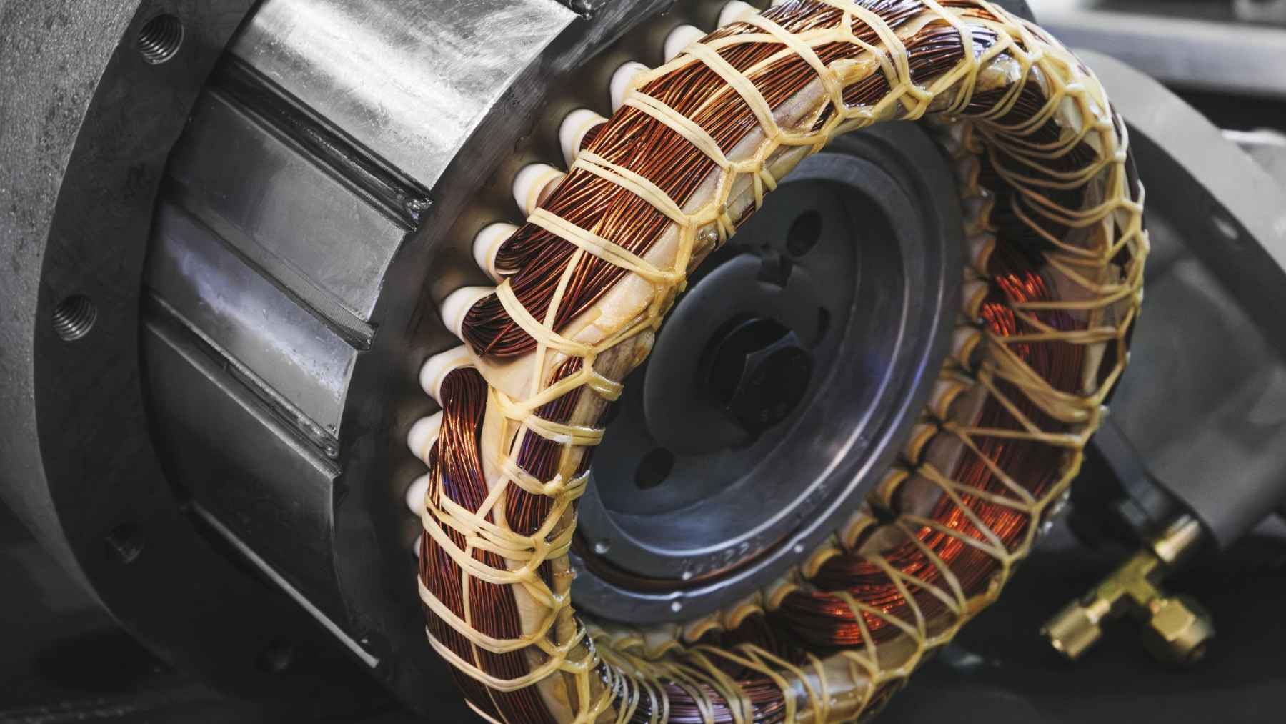 Perhaps the biggest problem with electric cars isn't the battery, but a magnet that fails in the heat 1 Close-up of an electric vehicle motor with exposed internal components, illustrating the heat-related magnet challenge linked to EV efficiency.