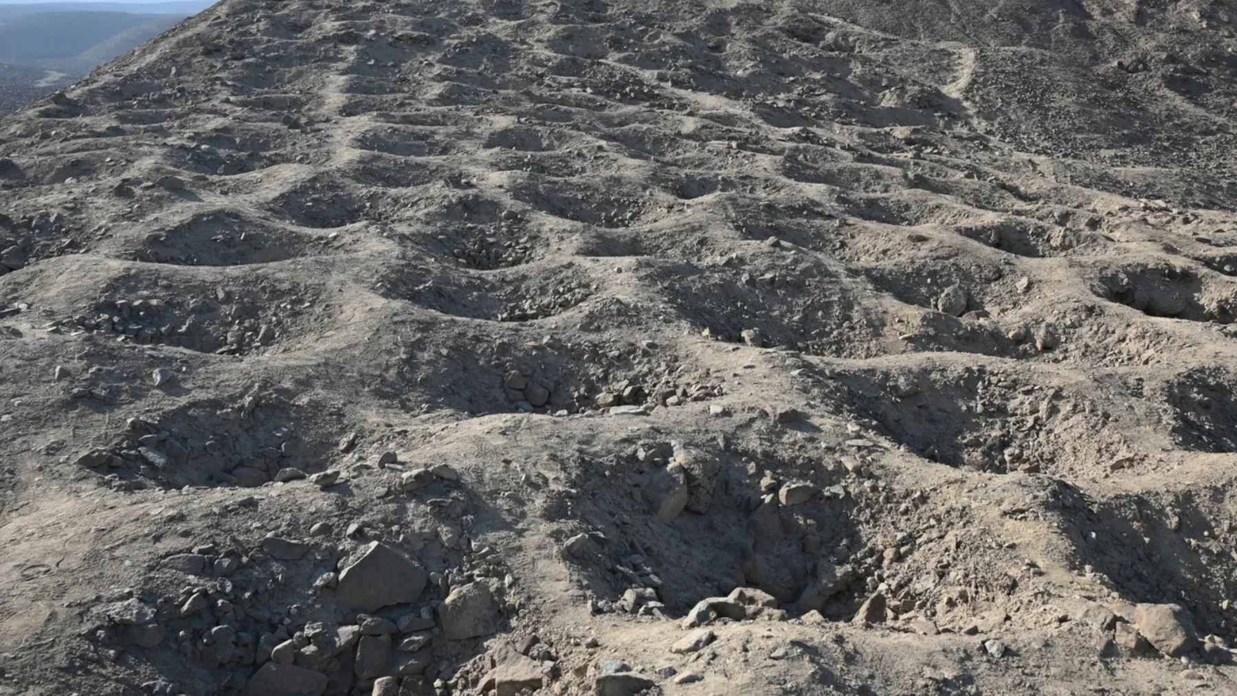 Band of Holes at Monte Sierpe in Peru showing thousands of pits carved into a hillside linked to ancient trade