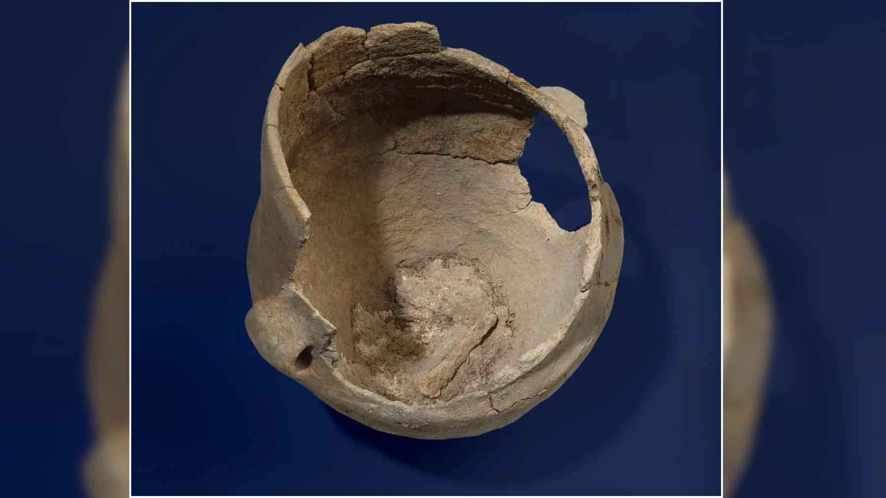 Prehistoric pottery vessel with burnt food residue inside, linked to a study on ancient European cuisine.