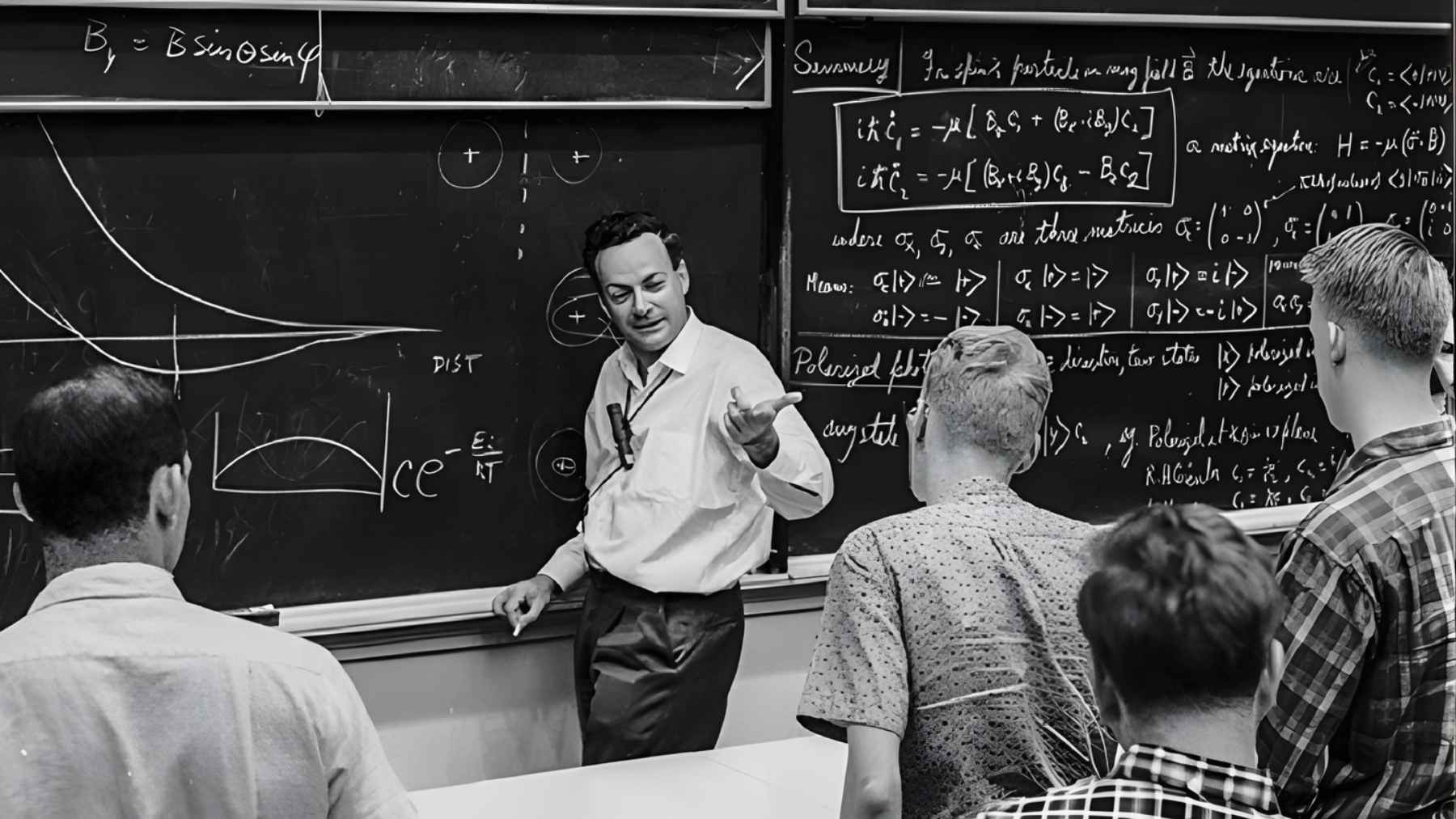 Richard Feynman teaching in front of a blackboard during the era when he inspired the idea of extreme miniaturization