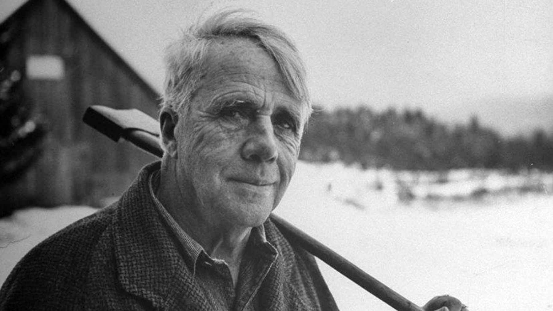 Robert Frost outdoors in winter in a portrait of the American poet