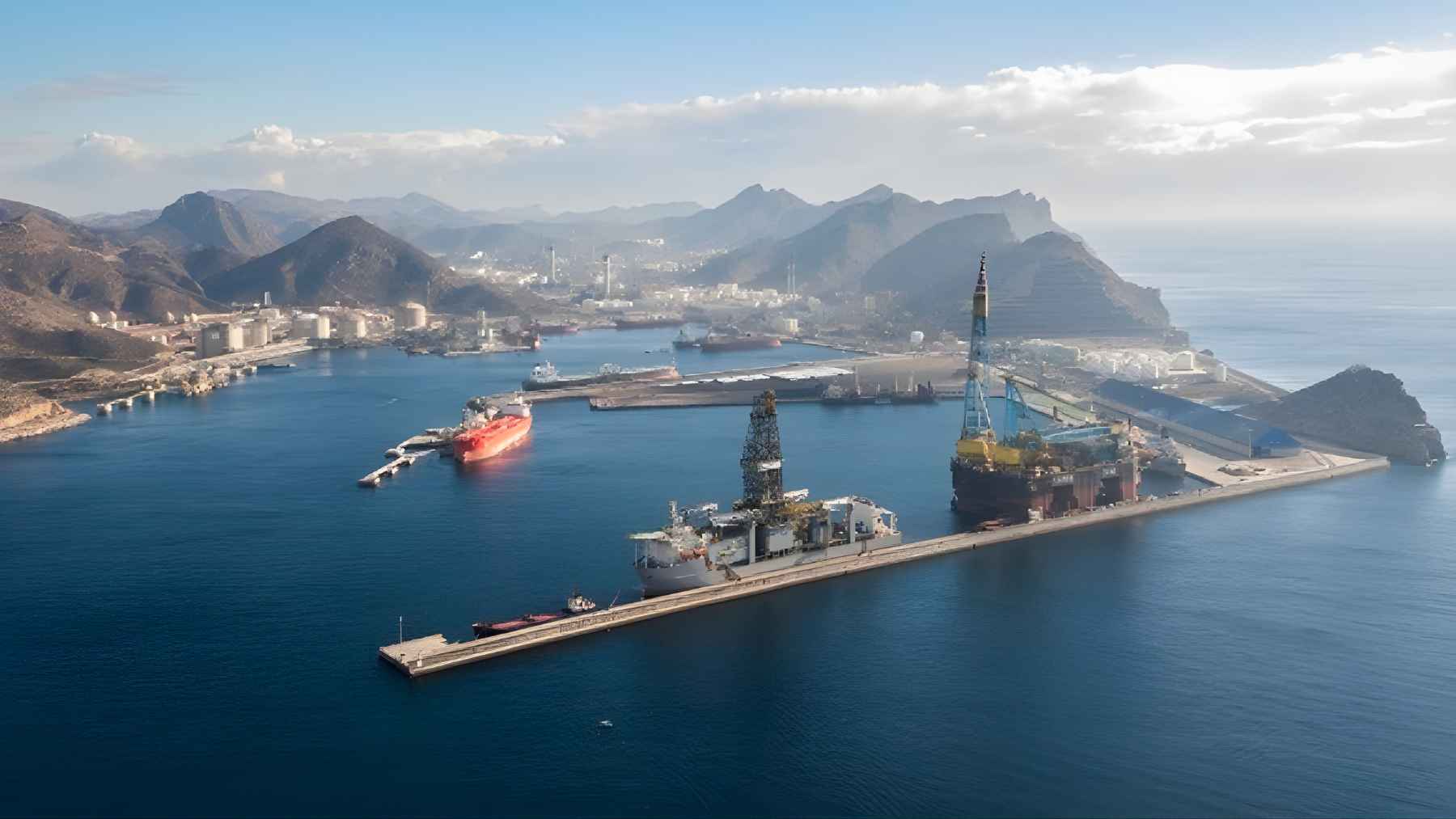 Oil tankers and cargo ships transiting the Strait of Hormuz, a key global shipping chokepoint facing sharp traffic decline