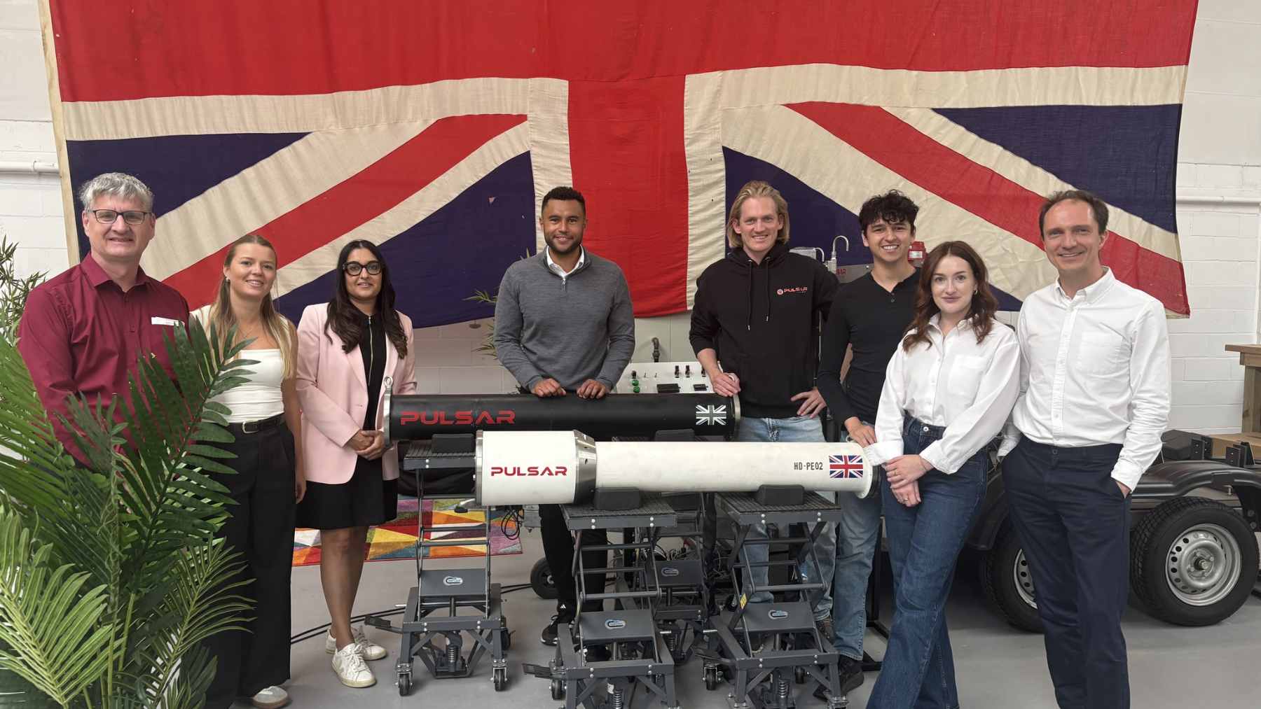 A bright plasma plume glowing from the exhaust of the Pulsar Fusion Sunbird rocket engine prototype during a test in the UK.