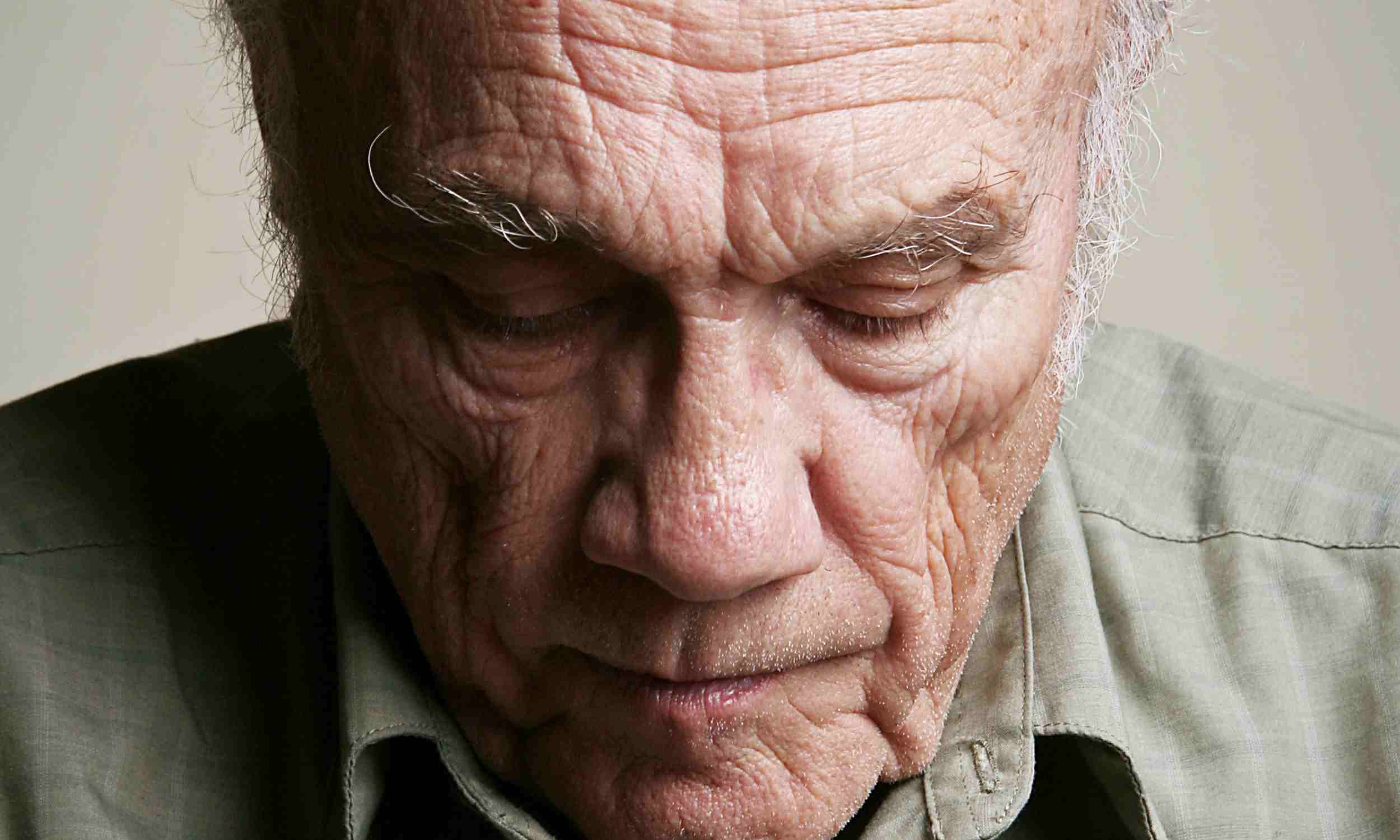 Older woman looking out a window and close-up of an older man, illustrating emotional distance, loneliness, and friendship struggles in adulthood